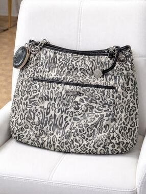 GRACE ADELE  leopard print tote with patent leather trim.